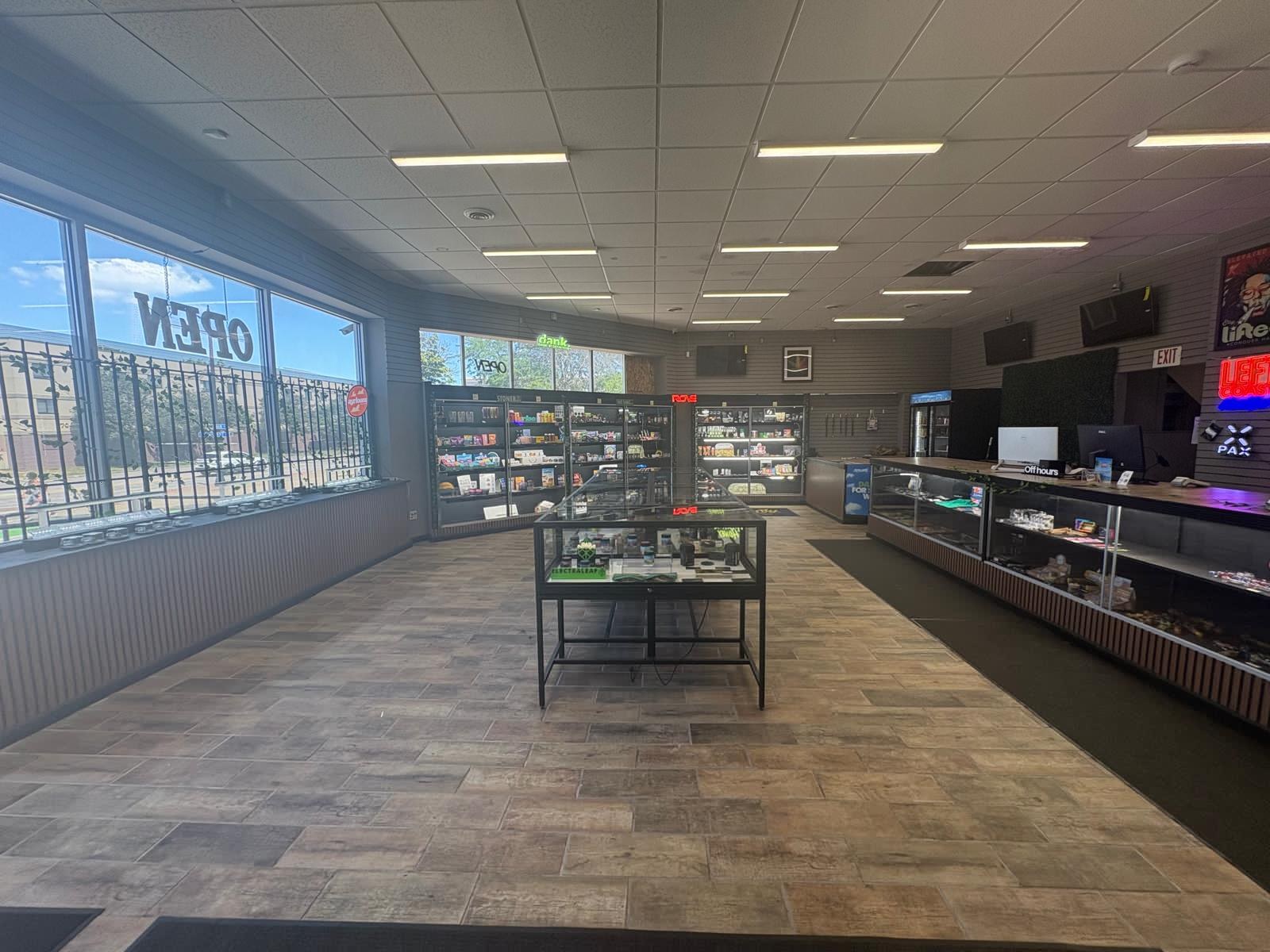 High Cloudz Buffalo interior — sunny front windows and accessories wall on the Main Street corridor
